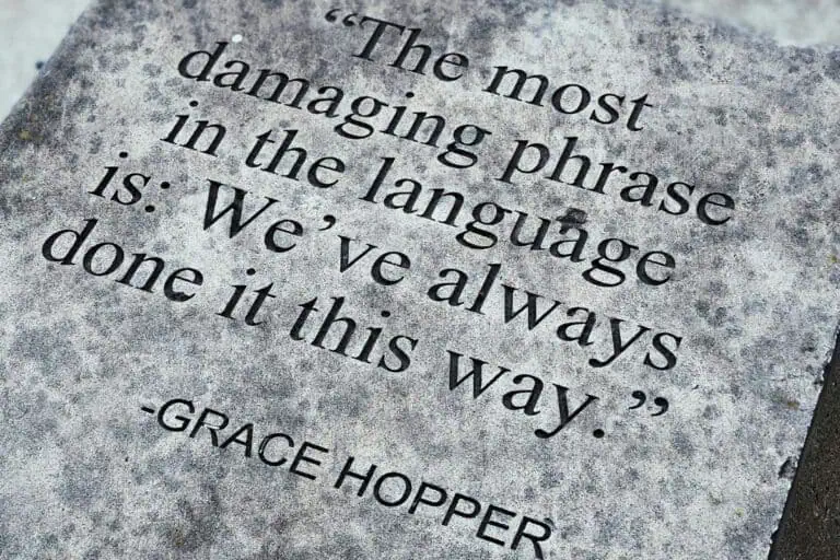 "engraved quote on stone reading 'the most damaging phrase in the language is: we've always done it this way' by grace hopper