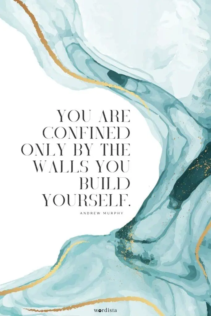 blue and gold abstract watercolor background with an andrew murphy quote "you are confined only by the walls you build yourself"
