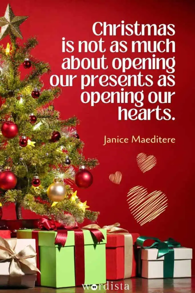 decorated christmas tree with gifts and janice maeditere quote on a red background