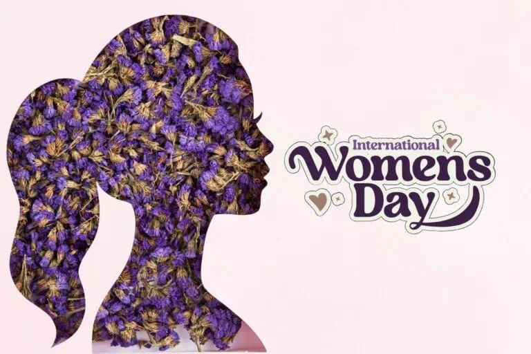 silhouette of a woman filled with purple dried flowers with international women’s day text on a pink background