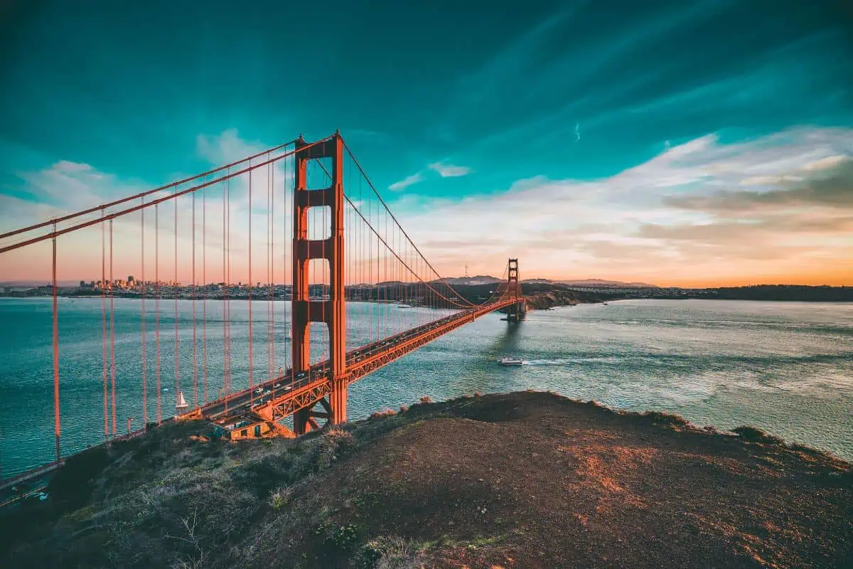 golden gate bridge overlooking the pacific ocean at sunset