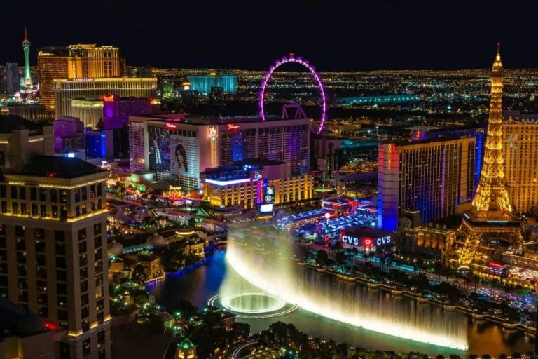 las vegas strip at night with bellagio fountains and city lights las vegas quotes
