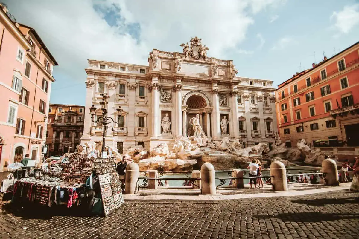 trevi fountain in rome with baroque sculptures and flowing water