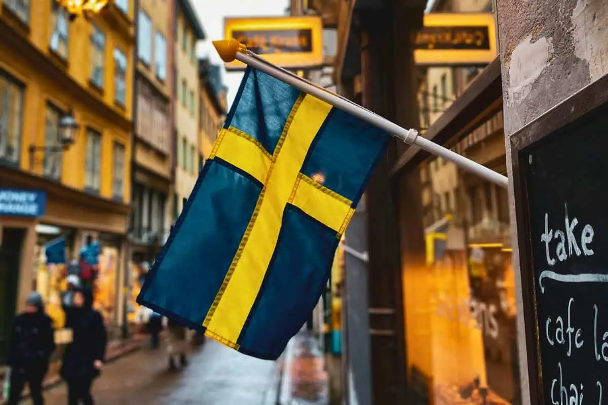 swedish flag on a cozy street scene reflecting the beauty of swedish words and culture